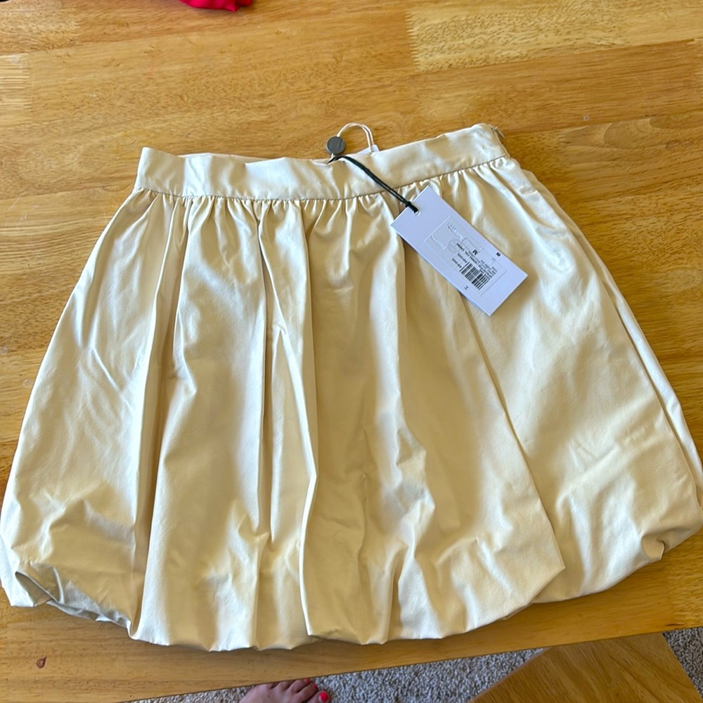 Champagne/cream color Italian pleather puffer skirt.